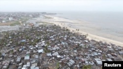 FILE - Drone footage shows destruction after Cyclone Idai in the settlement of Praia Nova, which sits on the edge of Beira, Mozambique, March 18, 2019.