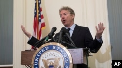 Sen. Rand Paul, R-Ky., tells reporters that he plans to oppose President Trump's nominations of CIA Director Mike Pompeo to be secretary of state and CIA Deputy Director Gina Haspel to lead the spy agency, during a news conference at the Capitol in Washington, Wednesday, March 14, 2018.