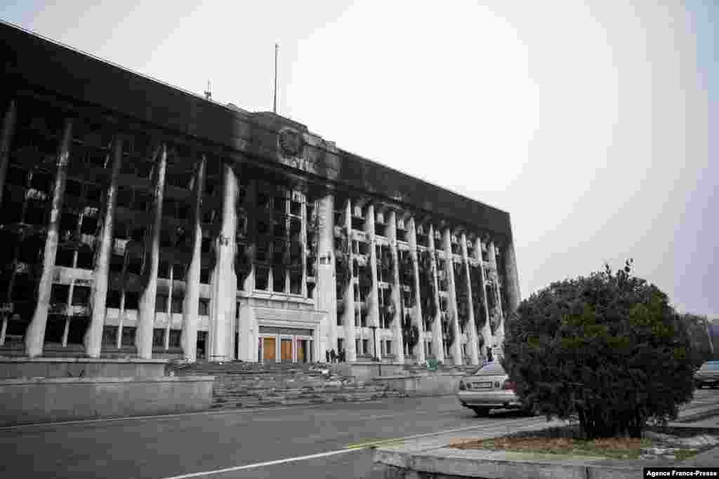 A burnt Almaty City Administration building is seen in central Almaty, Kazakhstan, following violent protests over the price increase of the fuel.