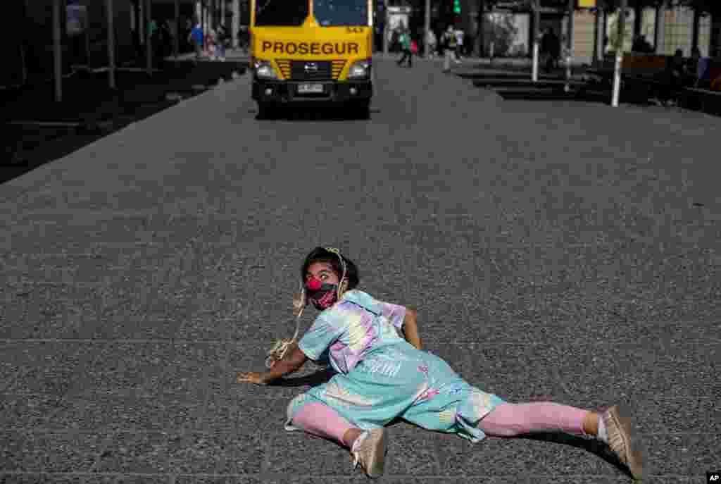 Constanza Mena poses for a photo during a red-nosed walk organized by the Flying Laughter clown group amid the new coronavirus pandemic, in downtown Santiago, Chile, April 28, 2021.