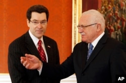 FILE - U.S. ambassador to the Czech Republic Norman L. Eisen, left, meets with Czech Republic's President Vaclav Klaus at the Prague Castle, Czech Republic, Jan. 28, 2011. Eisen, who was once President Barack Obama's top ethics lawyer, said that since Donald Trump's inauguration, "the ethics emergency of constitutional dimensions has galvanized me back into my initial Obama role."