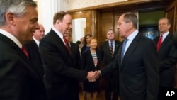 Russian Foreign Minister Sergey Lavrov, second right, greets U.S. Sen. Richard Shelby during his meeting with members of a U.S. congressional delegation in Moscow, Russia, July 3, 2018.