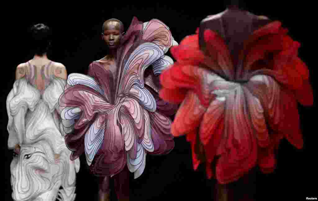 Models present creations by Dutch designer Iris van Herpen as part of her Haute Couture Spring-Summer 2019 collection show in Paris, France.