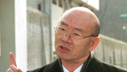 FILE - In this Dec. 22, 1997, photo, former South Korean President Chun Doo-hwan speaks to reporters in front of the Anyang Prison following his release from prison in a special government amnesty.