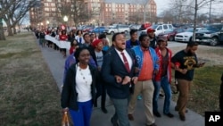 University of Oklahoma students march to the now closed University of Oklahoma's Sigma Alpha Epsilon fraternity house during a rally in Norman, Okla., March 10, 2015. 