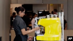 FILE - An employee works at a McDonald's restaurant in Chicago, Illinois, Aug. 8, 2018.