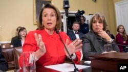 House Minority Leader Nancy Pelosi, D-Calif., and Hispanic Caucus Chair Rep. Michelle Lujan Grisham, D-N.M., right, appear before the House Rules Committee asking to add protections to the government funding bill for immigrants brought to the U.S. illegally as children, known as "Dreamers," on Capitol Hill, in Washington, Dec. 21, 2017.