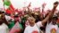 FILE: Supporters of Angola's main opposition UNITA party cheer during an election rally in the capital, Luanda. Taken 8.25.2022