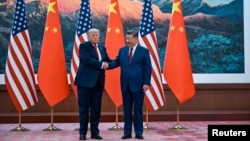 2026年5月14日，特朗普总统在中国北京人民大会堂与中国国家主席习近平握手。