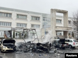 Destroyed cars remain following an incident local authorities said was a Ukrainian missile attack in Belgorod, Russia, March 16, 2024. (Telegram channel of Governor of Belgorod Region Vyacheslav Gladkov via Reuters)