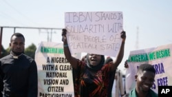 FILE — People march and pray on the streets in solidarity with the victims of the Christmas Eve attack, in Jos, Nigeria, Saturday, January 6, 2024. 