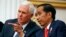 U.S. Vice President Mike Pence (left) talks with Indonesian President Joko Widodo during their meeting at Merdeka Palace in Jakarta, Indonesia, April 20, 2017. Pence is on a 10-day trip in Asia.