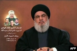 Gambar yang diambil dari TV al-Manar Hizbullah pada 19 Juni 2024, menunjukkan pemimpin Hizbullah Hassan Nasrallah memberikan pidato di televisi dari lokasi yang dirahasiakan di Lebanon. (Al-Manar / AFP)