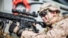 A U.S. Marine Corps rifleman with Kilo Company, Battalion Landing Team 3/5, provides security aboard the amphibious assault ship USS Boxer during its transit through Strait of Hormuz in Gulf of Oman, Arabian Sea, July 18, 2019. 