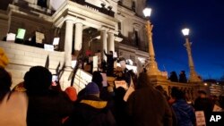 With a toxic water crisis gripping the city of Flint, protesters gather outside the Capitol in Lansing, Mich., before Gov. Rick Snyder's State of the State address, Jan. 19, 2016.