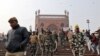 Police patrol the steps of Jama Masjid before Friday prayers in the old quarters of Delhi, India, Dec. 27, 2019. 