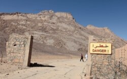 A danger sign is seen at a French nuclear test site in In-Ekker, near Ain Meguel in southern Algeria, Feb. 25, 2010.