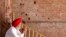 A Sikh man sits beside the wall of one of the complex of Golden Temple hit by the bullet shots during the operation Blue Star in the northern Indian city of Amritsar June 6, 2010.