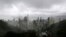 The clouds hang low over the city of Hong Kong, seen from the Victoria Peak, in Hong Kong, Aug. 13, 2013.