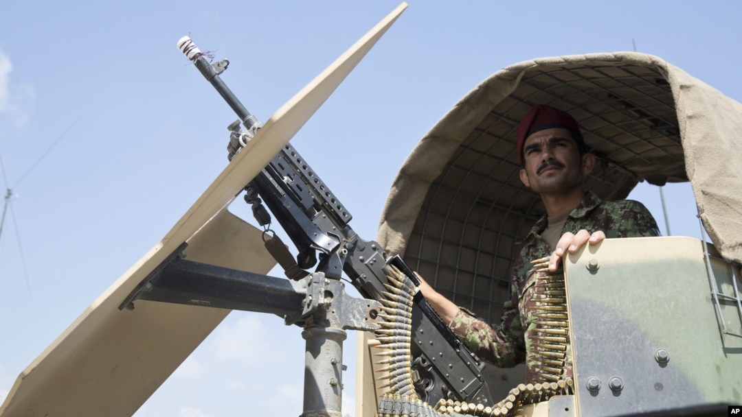 Afghanistan's National Army soldier stands guard in his vehicle in Camp Khogyani in Nangarhar province, east of Kabul, Afghanistan. 