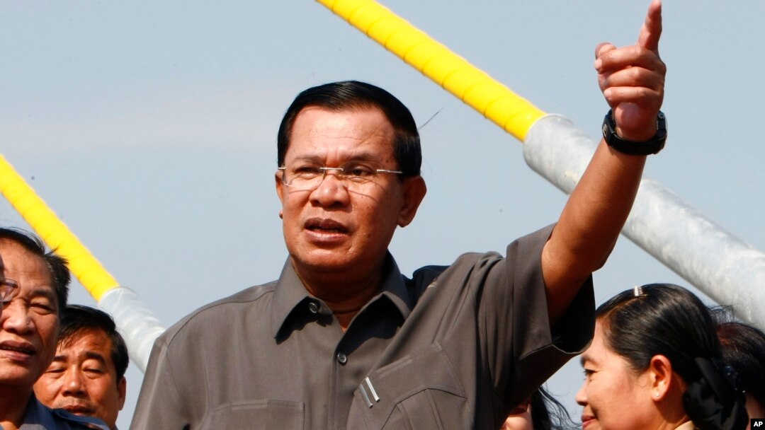 FILE - Cambodian Prime Minister Hun Sen, shown delivering a speech in Phnom Penh in January, calls Sam Rainsy, head of the opposition Cambodia National Rescue Party, a “traitor’s son.”