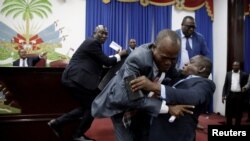 Deputies argue before a session to present the general policy of the appointed Prime Minister Fritz William Michel at the Parliament in Port-au-Prince, Haiti, Sept. 3, 2019. 