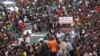 Protesters gather as thousands rally to call for the departure of South African company Waymark, which was hired by the Guinean government to re-do the country's electoral list, in Conakry, Guinea, September 20, 2012.