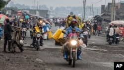 People displaced by fighting with M23 rebels make their way to the center of Goma, Democratic Republic of the Congo, Jan. 26, 2025.