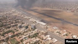 FILE PHOTO: Smoke rises over the city as army and paramilitaries clash in power struggle, in Khartoum