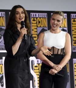 Rachel Weisz, left, and Scarlett Johansson participate during the "Black Widow" portion of the Marvel Studios panel on day three of Comic-Con International on July 20, 2019, in San Diego.