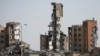 Buildings which were destroyed in previous Israeli bombardments stand in Nuseirat in the central Gaza Strip, on April 1, 2024, amid the ongoing battles Israel and the Hamas militant group.