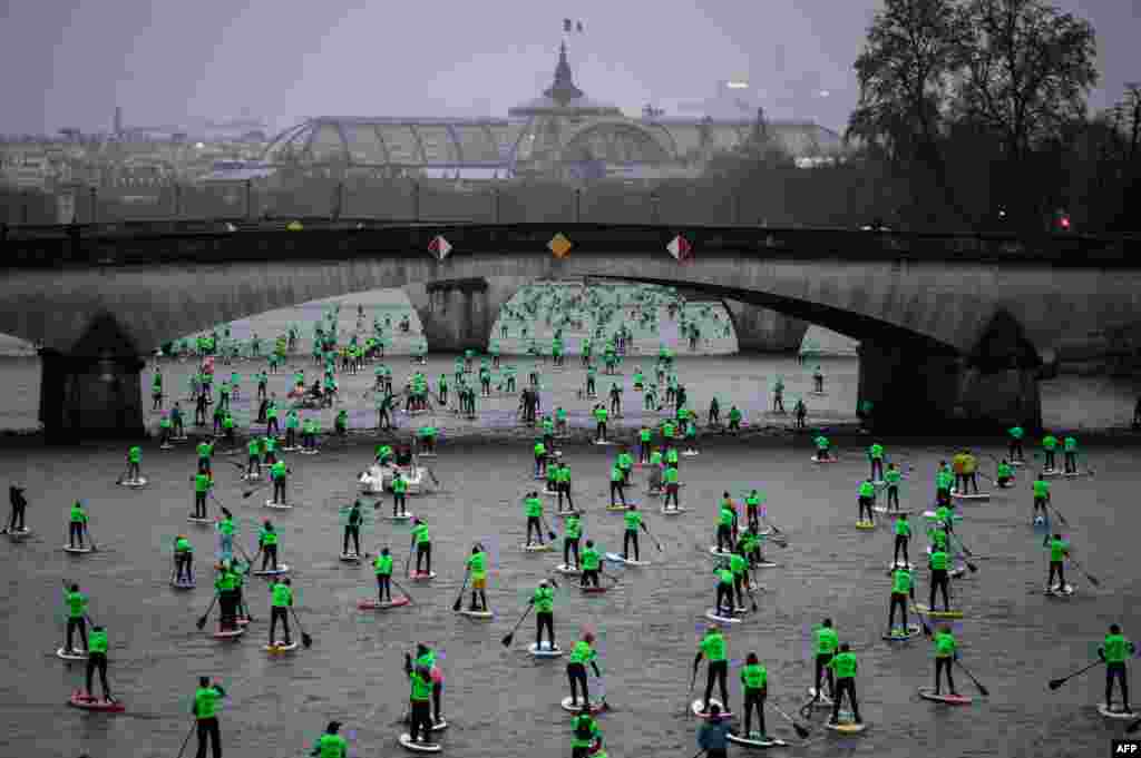 Competitors take part in the Nautic Paddle Race on the Seine river in Paris, France. About 1,000 competitors took part in the 11-kilometer race.