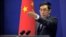 China's Foreign Ministry spokesman Liu Weimin gestures to a journalist during a news conference in Beijing (file photo). 