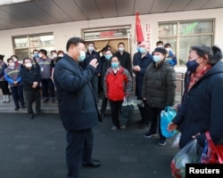 Chinese President Xi Jinping inspects the novel coronavirus prevention and control work at Anhuali Community in Beijing, China, Feb. 10, 2020. (Xinhua via Reuters)