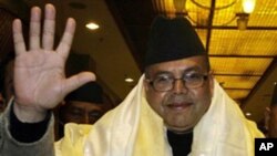 Chairman of Communist party of Nepal (United Marxist -Leninist) Jhal Nath Khanal waves after being elected as Nepal's Prime Minister in Katmandu, Nepal. Nepal's parliament finally elected Khanal as the new prime minister in its 17th attempt since the last