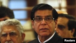 Pakistan's Prime Minister Raja Pervez Ashraf speaks to the media at a military hospital, where he visited Malala Yousufzai, in Rawalpindi, October 12, 2012.