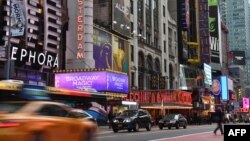 FILE - A view of Broadway theaters on 42nd Street seen on March 12, 2020 in New York City. (Photo by Angela Weiss / AFP)