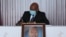 Agathon Rwasa, the head of the National Council for Freedom (CNL), Burundi's main opposition party, wears a face mask as he signs  the book of condolences at the state house in Bujumbura, June 12, 2020.