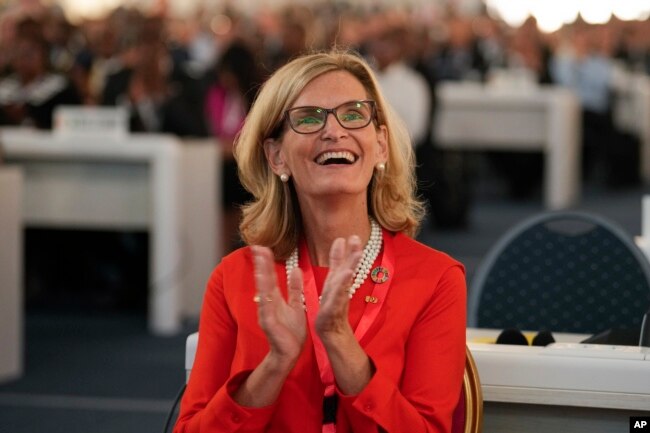 Doreen Bogdan-Martin of the United States, candidate for secretary general, smiles during the opening session of The International Telecommunication Union (ITU), the United Nations specialized agency for information and communication technologies, in Bucharest, Romania, Monday, Sept. 26, 2022. The ITU Plenipotentiary Conference 2022 will run in the Romanian capital until Oct. 14 and will elect a new Secretary General. (AP Photo/Vadim Ghirda)