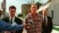 In this 1998 photo, Wesley Ira Purkey, center, is escorted by police officers in Kansas City, Kan., after he was arrested in connection with the death of 80-year-old Mary Ruth Bales. 