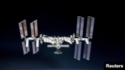 FILE: ISS photographed by Expedition 56 crew members from a Soyuz spacecraft after undocking, Oct. 4, 2018.