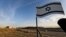 G'arbiy Sohildagi Shlomtzion yahudiy aholi punktida o'rnatilgan Isroil bayrog'i, 2020-yil, 27-yanvar