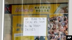 A sign on a closed Waffle House on Highway US 19 in anticipation of Hurricane Milton on Oct. 8, 2024, in New Port Richey, Fla.