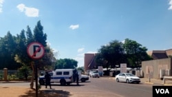 Police vehicles patrol roads leading to the Zimbabwe Embassy in Gaborone, Botswana, Oct. 26 2024. (Mqondisi Dube/VOA)