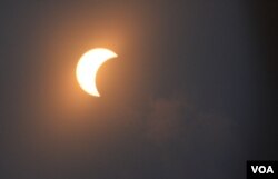 FILE - The moon is seen as it passes in front of the sun during a partial solar eclipse in Washington, D.C., Monday, Aug. 21, 2017. (Photo: Diaa Bekheet)