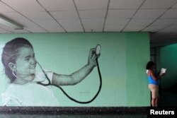 A painting by Cuban artist Maisel Lopez is seen on a wall inside a hospital in Havana, Cuba, April 20, 2017.