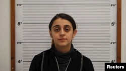 Tareena Shakil is seen after her arrest, in this undated booking picture courtesy of West Midlands Police. 
