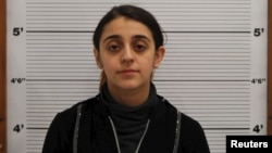 Tareena Shakil is seen after her arrest, in this undated booking picture courtesy of West Midlands Police. 