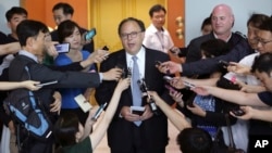 U.S. Special Envoy for Six-Party Talks Sydney Seiler, center, speaks to the media after his meeting with South Korean senior officials at the Foreign Ministry in Seoul, South Korea, July 27, 2015. 