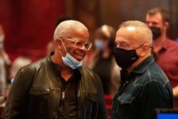 Composer Terence Blanchard, left, talks with co-director James Robinson at intermission during a rehearsal of Fire Shut Up in My Bones at the Metropolitan Opera house, Friday, Sept. 24, 2021, in New York. (AP Photo/Jason DeCrow)